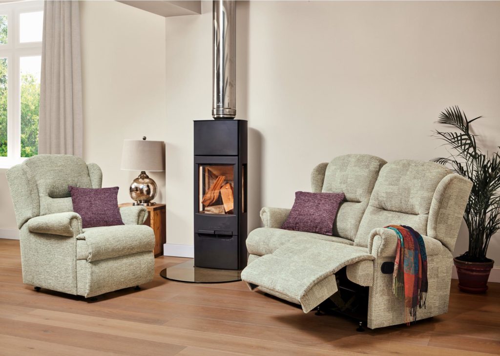 Collection of adjustable recliners by a stove